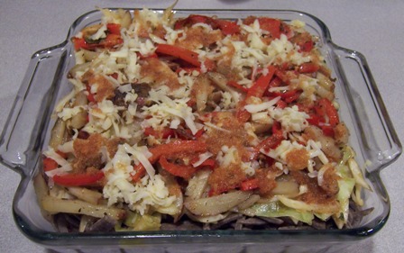 pizzoccheri layered with stir fried vegetables and cheese
